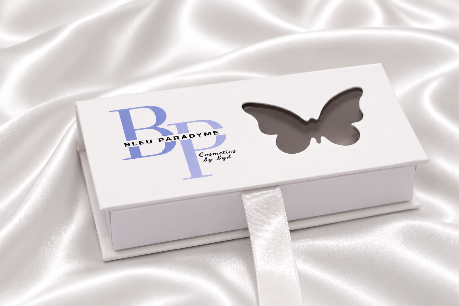Bleu Paradyme strip lashes displayed with packaging
